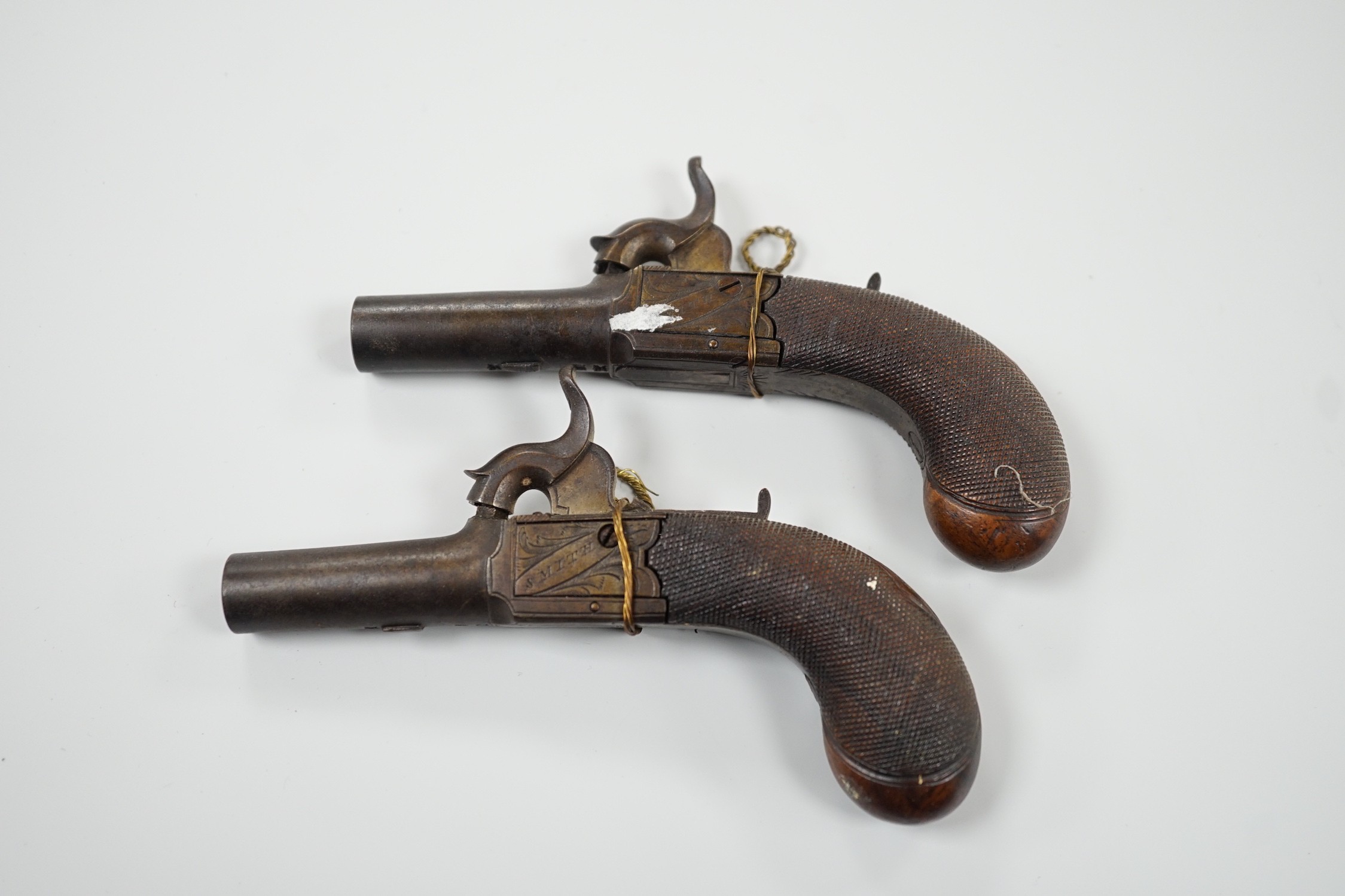 A pair of 19th century Smith of London percussion cap muff pistols, 12.5cm